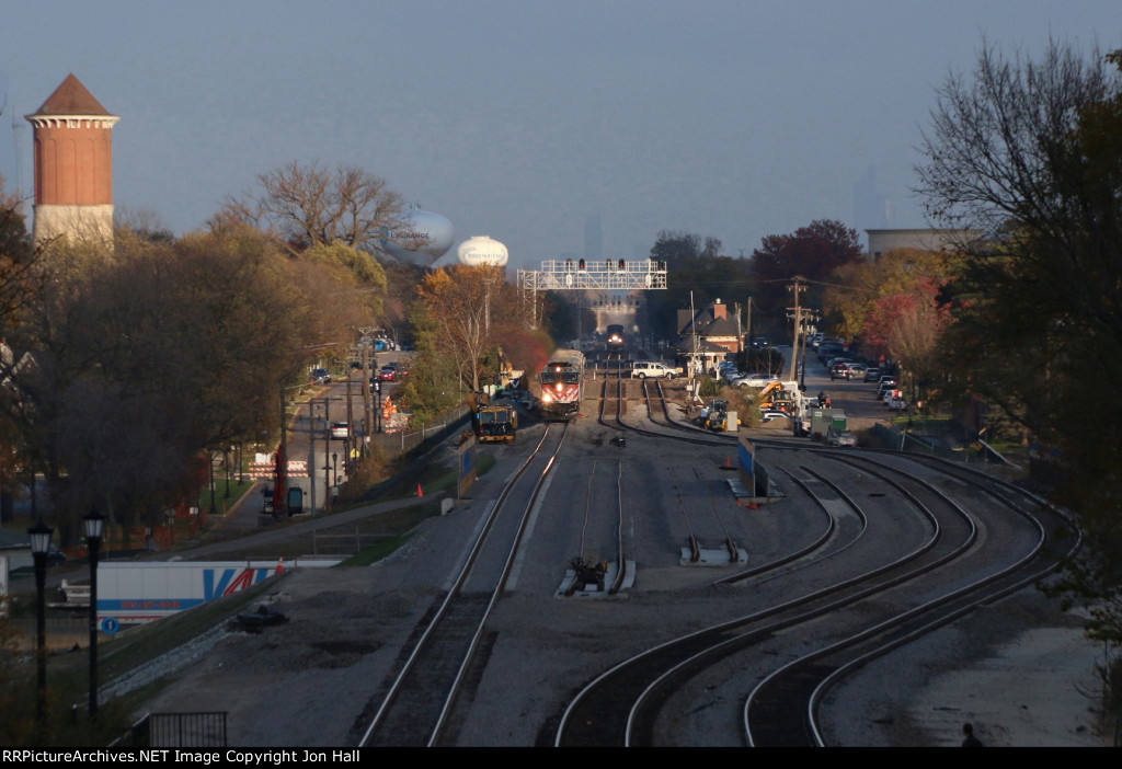 After departing Western Springs, an outbound Metra approaches as the Southwest Chief comes up behind it